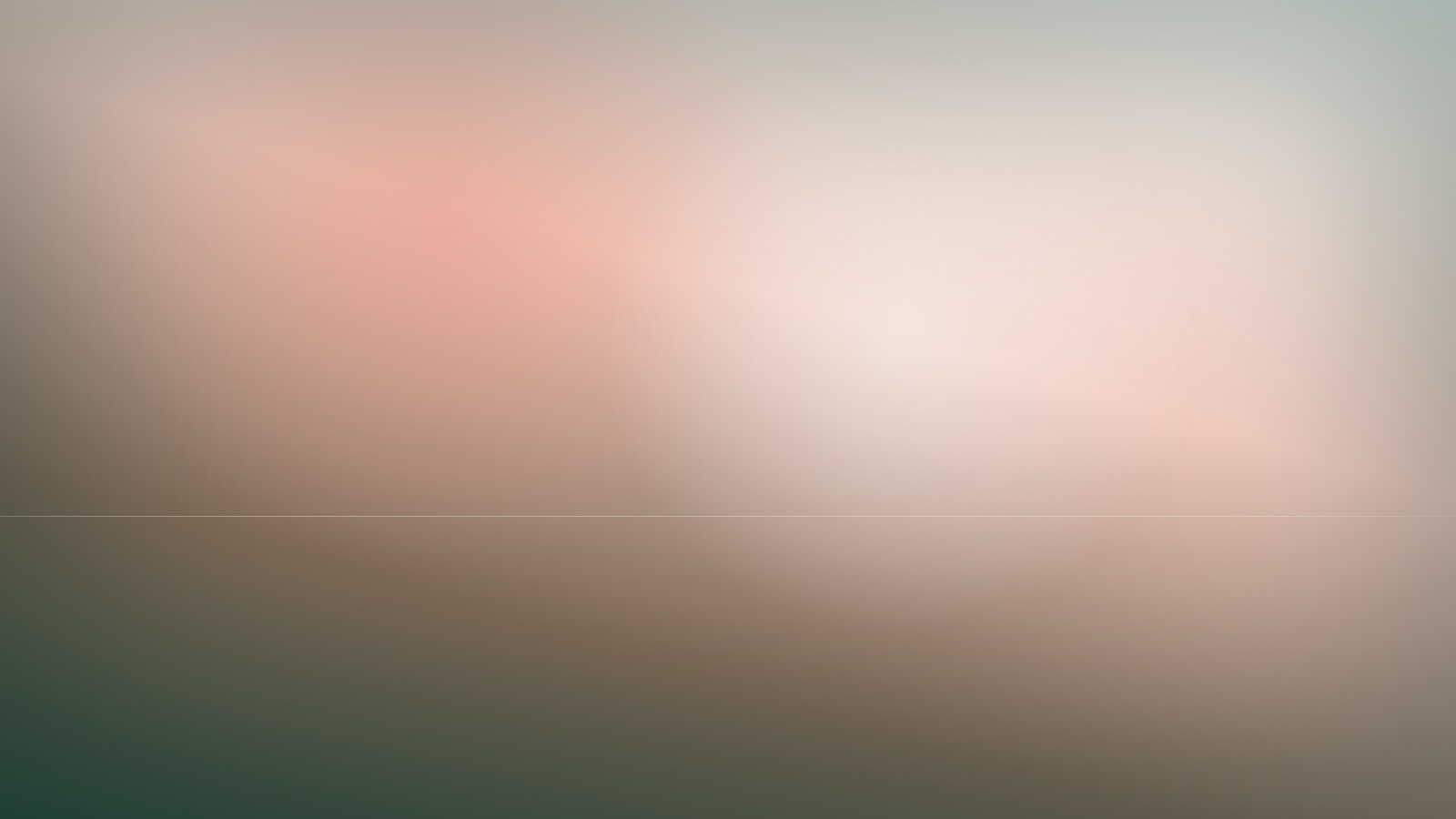A calm open field of gentle colour under a steady, quiet light.